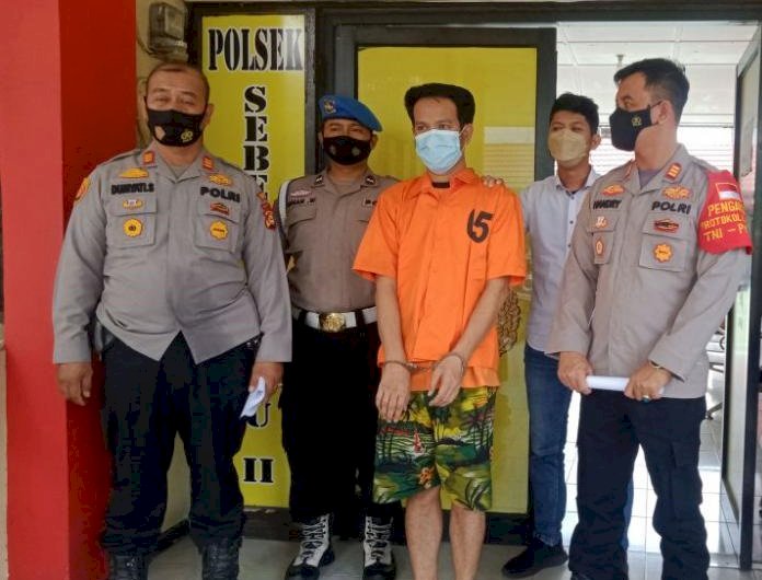 Tersangka saat ditangkap Polsek SU II Palembang. (Istimewa/rmolsumsel.id)