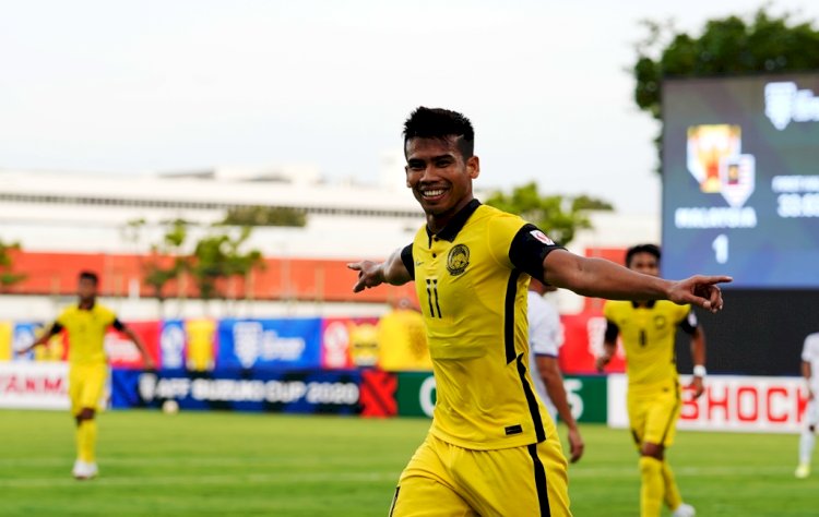 Gelandang serang Malaysia Safawi Rasid melakukan selebrasi usai mencetak trigol ke gawang Laos, Kamis (9/12). (AFF Suzuki Cup 2020/rmolsumsel.id)