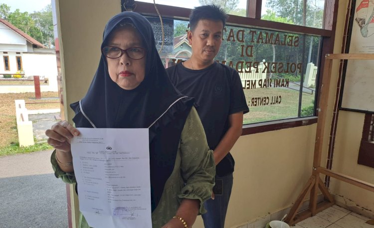 Keluarga Kades Suka Damai membuat laporan pengaduan kepolisan di Polsek Pedamaran/ist