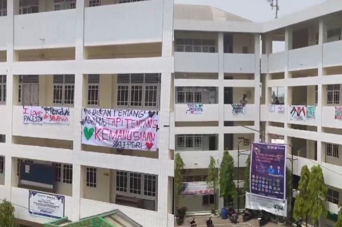  Mahasiswa Universitas PGRI Palembang membentangkan sepanduk dukungan Palestina di gedung kampus. (Denny Pratama/RMOLSumsel.id)