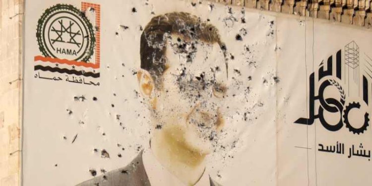 Poster Bashar Al-Assad yang dihancurkan/Net