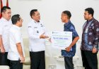 Bupati Muba Serahkan Santunan Jaminan Kematian Rp42 Juta kepada Ahli Waris Pekerja Rentan